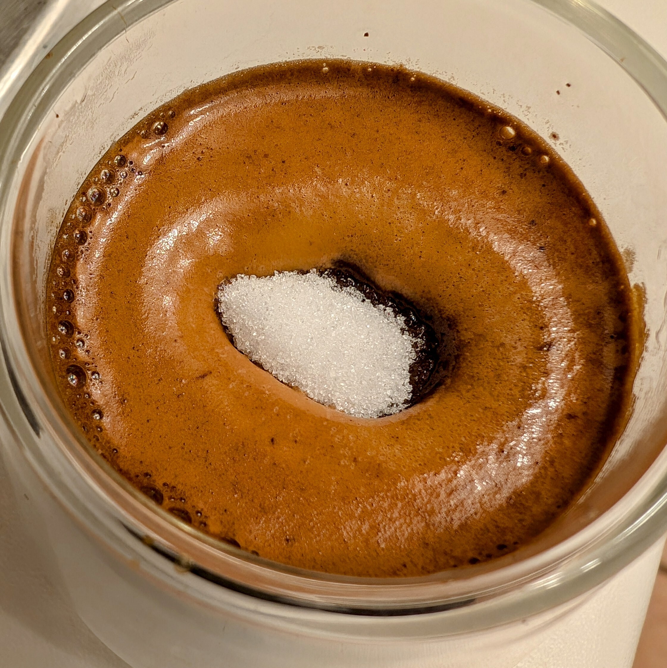 sugar island sitting on a layer of crema from an espresso shot