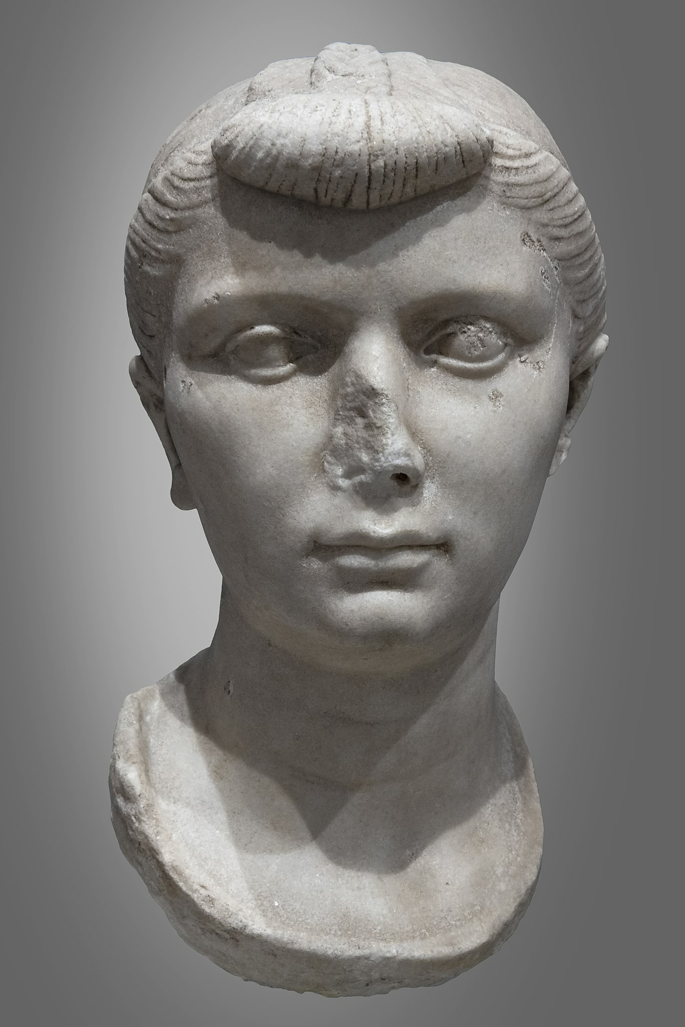 Bust of Julia the Elder. She has a distinctive hairstyle with rolled and pinned back fringe. From the Musée Saint-Raymond Toulouse.