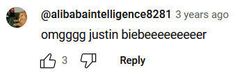 " omgggg justin biebeeeeeeeeer" by @alibabaintelligence8281 3 years ago, a YouTube reply. The profile picture shows a reddish-brown dog at a computer next to a bottle of Coke. The reply has 3 upvotes.